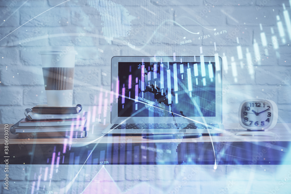 Stock market chart hologram drawn on personal computer background. Double exposure. Concept of investment. Stock market chart hologram drawn on personal computer background. Double exposure. Concept of investment.