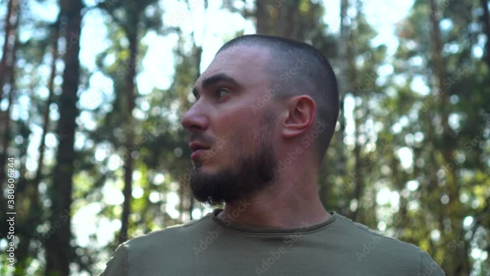 A Traveler Exits From The Depth Of The Forest, Looks At The Sides And Goes Further. The concept of Scout, Research, Travel, Survival. A Man Lost his Way in the Forest. A Traveler Exits From The Depth Of The Forest, Looks At The Sides And Goes Further. The concept of Scout, Research, Travel, Survival. A Man Lost his Way in the Forest.