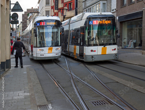 Ghent, Belgium: two trams block one of the narrow streets, Nederkouter, in the city centre.