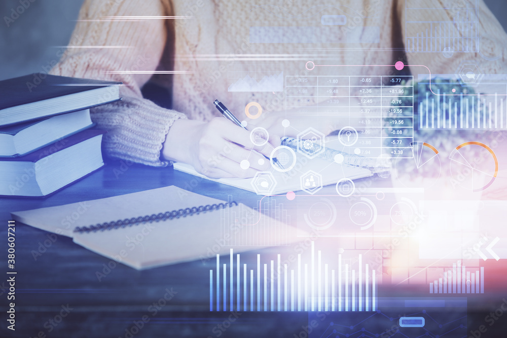 Double exposure of writing hands on background with data solution hologram on front. Technology concept. Close up Double exposure of writing hands on background with data solution hologram on front. Technology concept. Close up