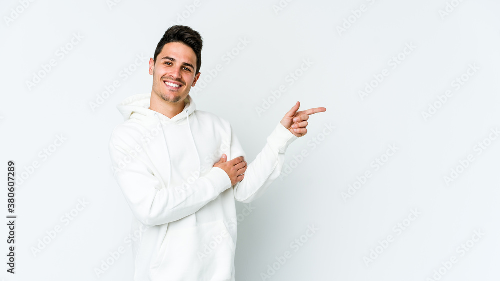Young caucasian man isolated on white background smiling cheerfully pointing with forefinger away. Young caucasian man isolated on white background smiling cheerfully pointing with forefinger away.