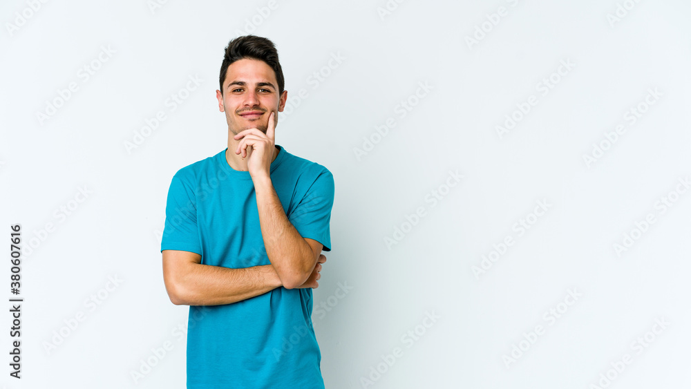 Young caucasian man isolated on white background smiling happy and confident, touching chin with hand. Young caucasian man isolated on white background smiling happy and confident, touching chin with hand.