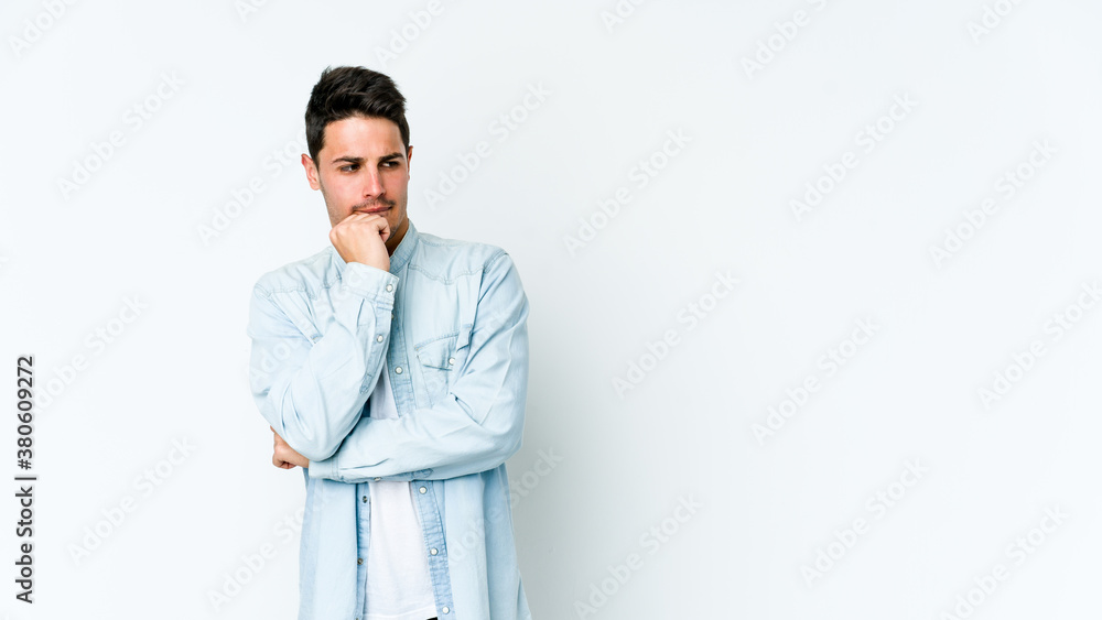 Young caucasian man isolated on white background confused, feels doubtful and unsure. Young caucasian man isolated on white background confused, feels doubtful and unsure.