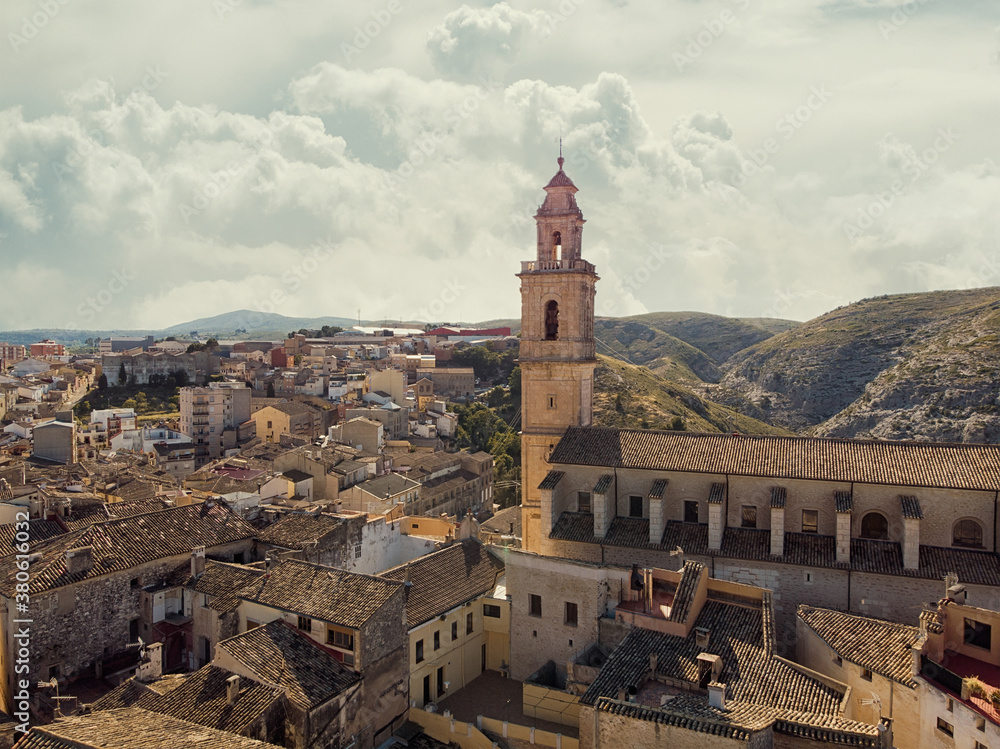 Aerial image ancient architecture view of Bocairent against hills and cloudy sky background. Valencian Community, Spain