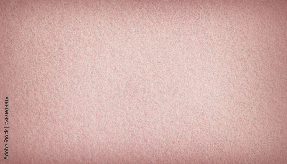 Fototapeta premium Pink pastel felt fabric background texture with vignette.