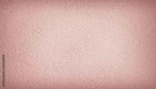 Pink pastel felt fabric background texture with vignette.