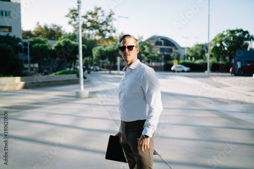 Professional adult man standing in downtown