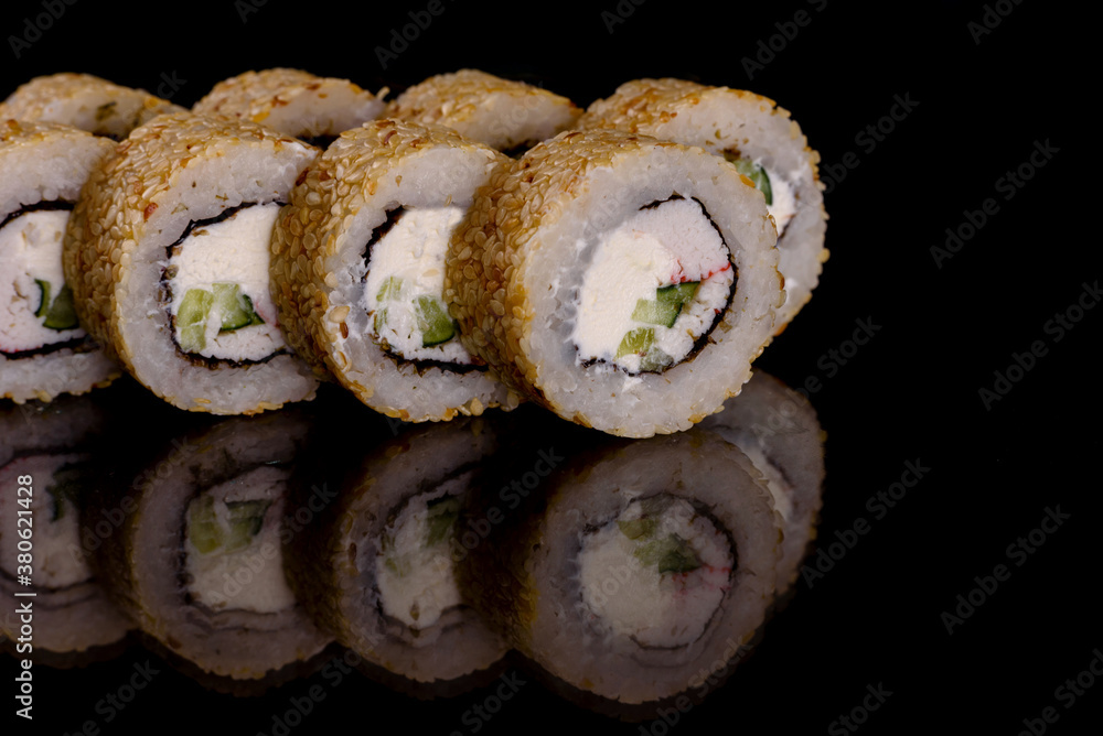 Fresh delicious beautiful sushi rolls on a dark background Fresh delicious beautiful sushi rolls on a dark background