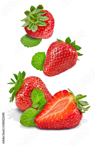 Set of juicy strawberries with mint leaves isolated on white background. Whole and cut in half. Close up, copy space
