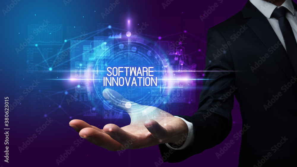 Man hand holding SOFTWARE INNOVATION inscription, technology concept Man hand holding SOFTWARE INNOVATION inscription, technology concept
