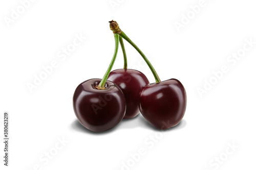 Three burgundy sweet cherries with stems isolated on white background. Close up, side view