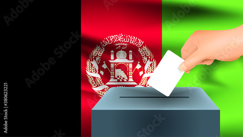 Male hand puts down a white sheet of paper with a mark as a symbol of a ballot paper against the background of the Afghanistan flag, Afghanistan the symbol of elections