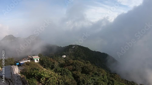 Time lapse of clouds floating in the valley of Parasnath Ranges in Jharkhand, India. photo