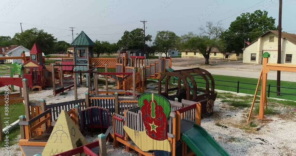 Aerial view truck right to left of a playground in Ponder Texas.
