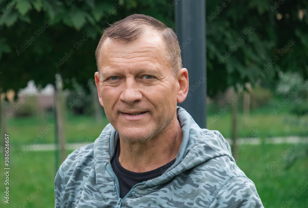 Portrait of a middle-aged man on the background of nature Portrait of a middle-aged man on the background of nature