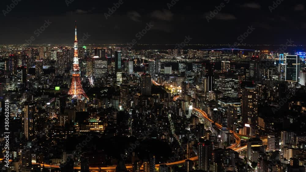 Beautiful panoramic Timelapse of Tokyo night cityscape with Tokyo Tower illuminations and traffic - Panning Shot Beautiful panoramic Timelapse of Tokyo night cityscape with Tokyo Tower illuminations and traffic - Panning Shot