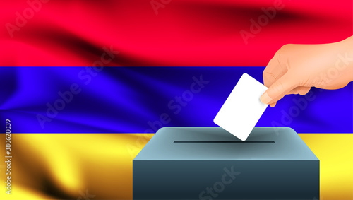 Male hand puts down a white sheet of paper with a mark as a symbol of a ballot paper against the background of the Armenia flag. Armenia the symbol of elections