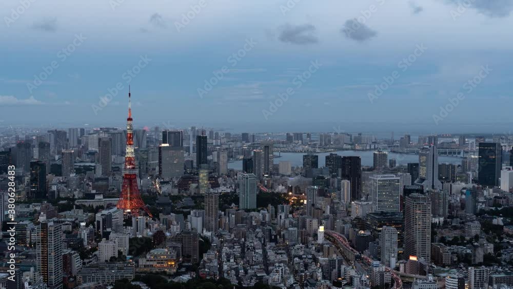 Beautiful 4k Timelapse over Tokyo cityscape at dusk illumination lighting up Tokyo Tower - Zoom Out Beautiful 4k Timelapse over Tokyo cityscape at dusk illumination lighting up Tokyo Tower - Zoom Out