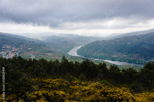 Aerial view of a landscape with buildings and a river in Casal de Loivos Miradouro, Portugal photo