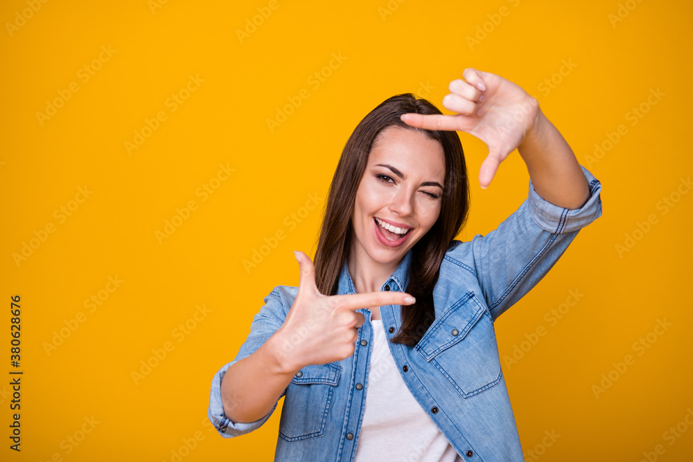Photo of excited energetic girl make fingers imagine she photographing wink blink wear good look clothes isolated over shine color background Photo of excited energetic girl make fingers imagine she photographing wink blink wear good look clothes isolated over shine color background