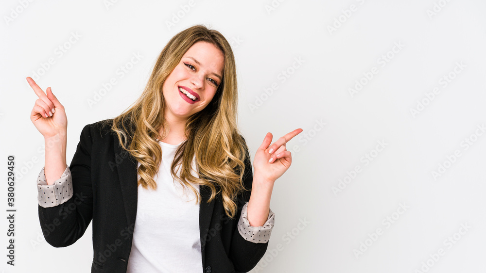 Young caucasian business woman isolated on white background Young caucasian bussines womanpointing to different copy spaces, choosing one of them, showing with finger. Young caucasian business woman isolated on white background Young caucasian bussines womanpointing to different copy spaces, choosing one of them, showing with finger.