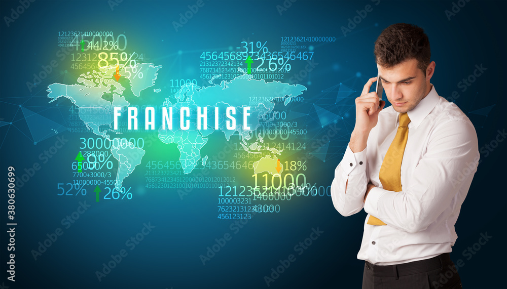 Businessman in front of a decision with FRANCHISE inscription, business concept Businessman in front of a decision with FRANCHISE inscription, business concept
