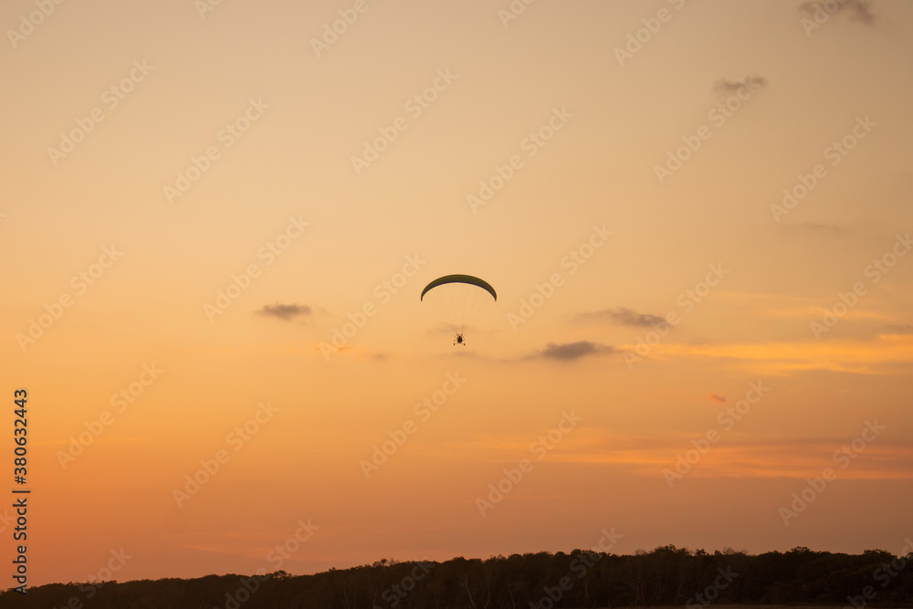 Paraglider Over Sunset