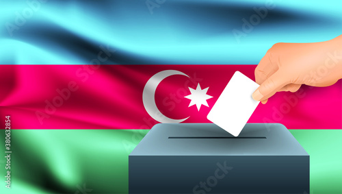 Male hand puts down a white sheet of paper with a mark as a symbol of a ballot paper against the background of the Azerbaijan flag. Azerbaijan the symbol of elections