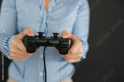 Young female playing video-games concentrating