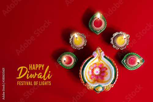 Happy Diwali - Clay Diya lamps lit during Dipavali, Hindu festiv photo