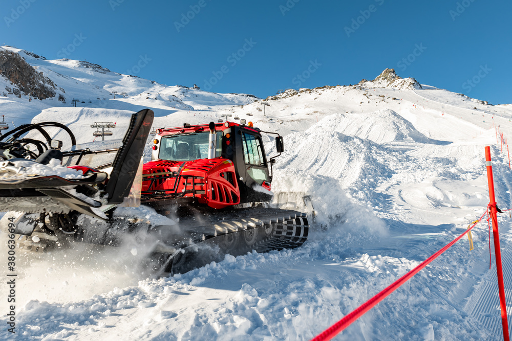 Red modern snowcat ratrack with snowplow snow grooming machine preparing ski  slope piste hill at alpine skiing winter resort Ischgl in Austria. Heavy  machinery mountain equipment track vehicle Stock Photo | Adobe