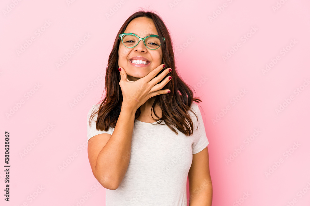 Young mixed race hispanic woman isolated doubting between two options. Young mixed race hispanic woman isolated doubting between two options.