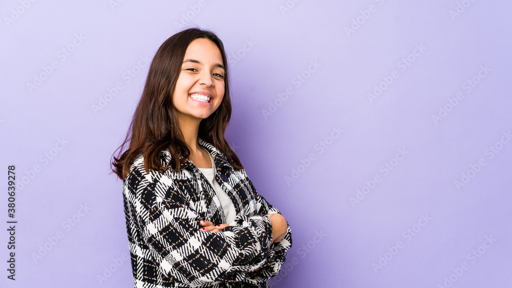 Young mixed race hispanic woman isolated who feels confident, crossing arms with determination. Young mixed race hispanic woman isolated who feels confident, crossing arms with determination.