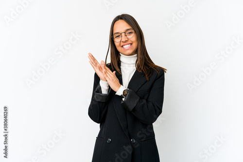 Young mixed race business woman isolated on white background feeling energetic and comfortable, rubbing hands confident.