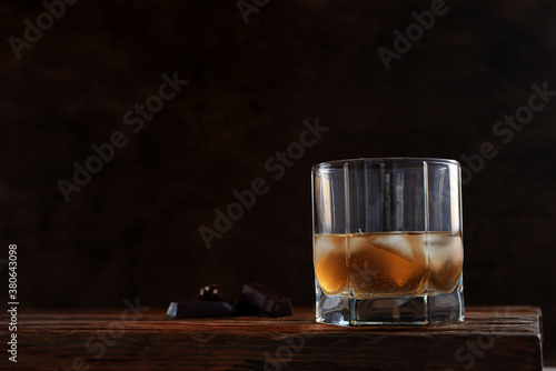 cold alcoholic drink in a glass stock on wooden table