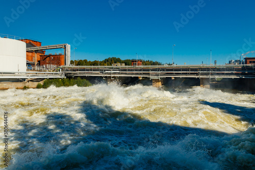 Rough waters of bypass on rapids Kuusankoski, Finland photo