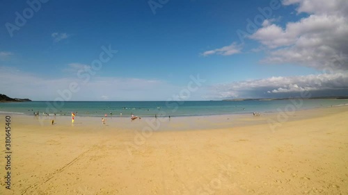 A drone takes off from a beautiful secluded beach at Carbis bay, Cornwall, Penzance, Beautiful yellow sand and lovely see through oceans