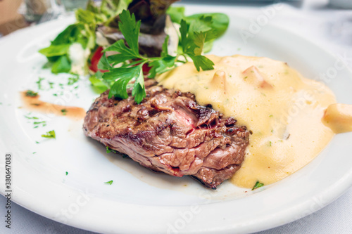 juicy steak veal beef meat with tomato and vegetables