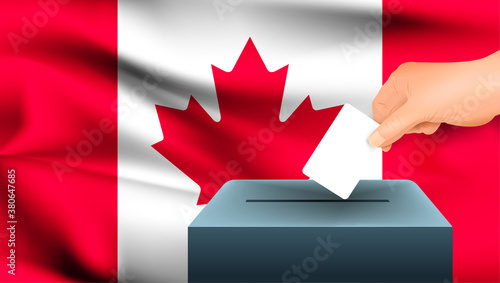 Male hand puts down a white sheet of paper with a mark as a symbol of a ballot paper against the background of the Canada flag. Canada the symbol of elections