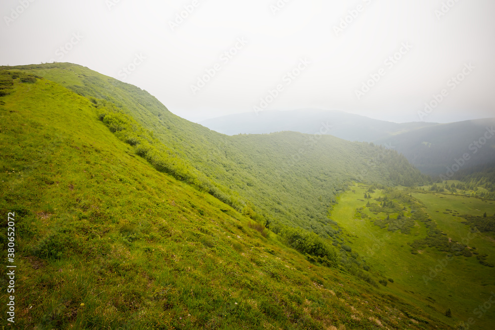 green mountain ridge at the quiet wet day, outdoor travel background