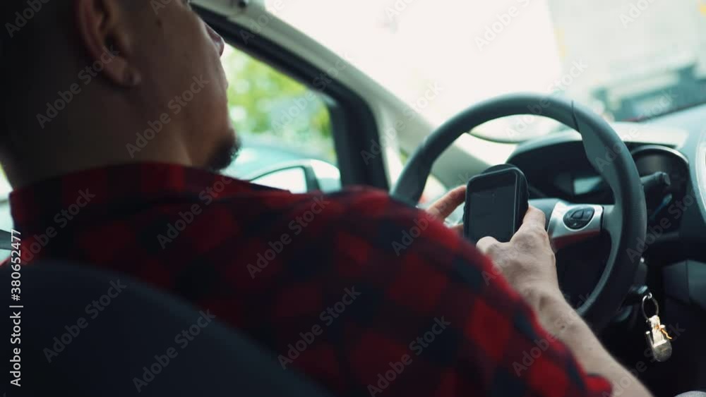 Responsible Caucasian Male Driver Typing Message on Smartphone In Parked Car By Road 4k Responsible Caucasian Male Driver Typing Message on Smartphone In Parked Car By Road 4k