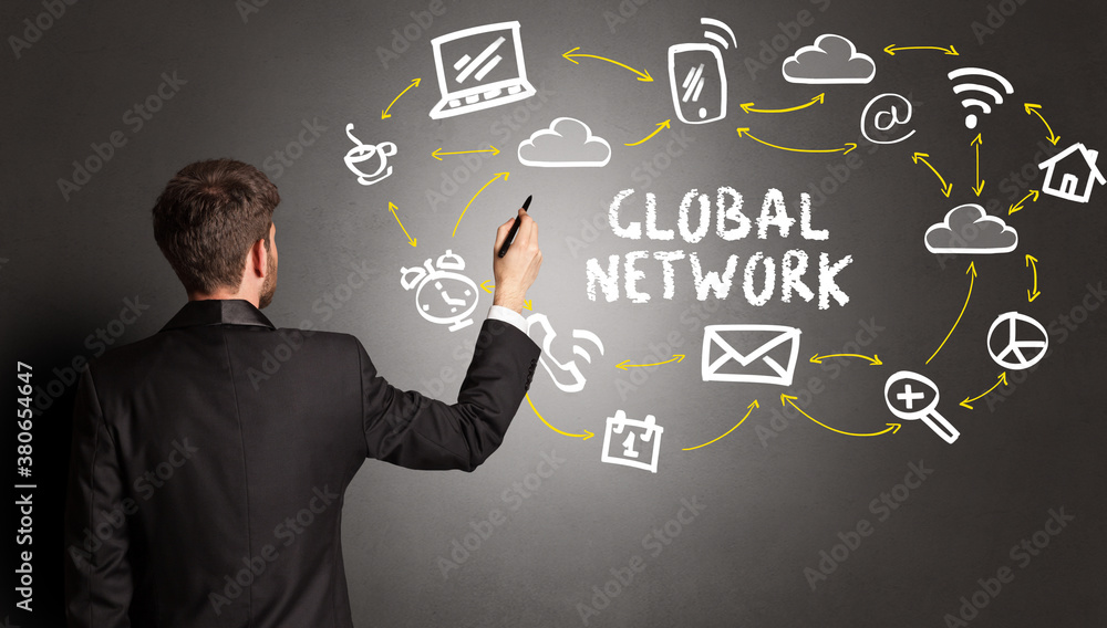 businessman drawing social media icons with GLOBAL NETWORK inscription, new media concept businessman drawing social media icons with GLOBAL NETWORK inscription, new media concept