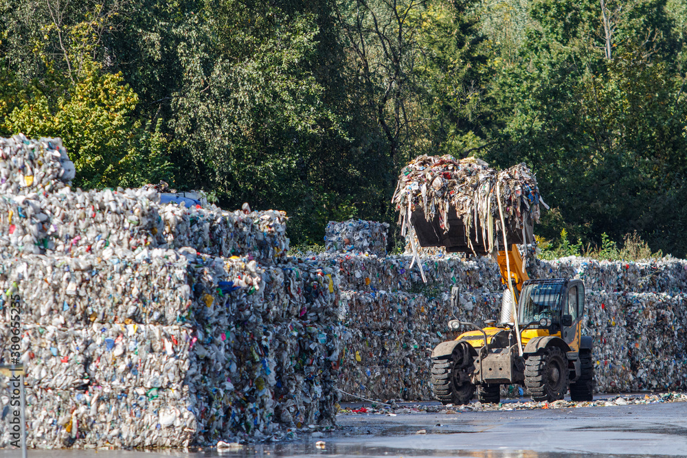 Garbage recycling. Waste sorting and recycling. Workers packaging ...
