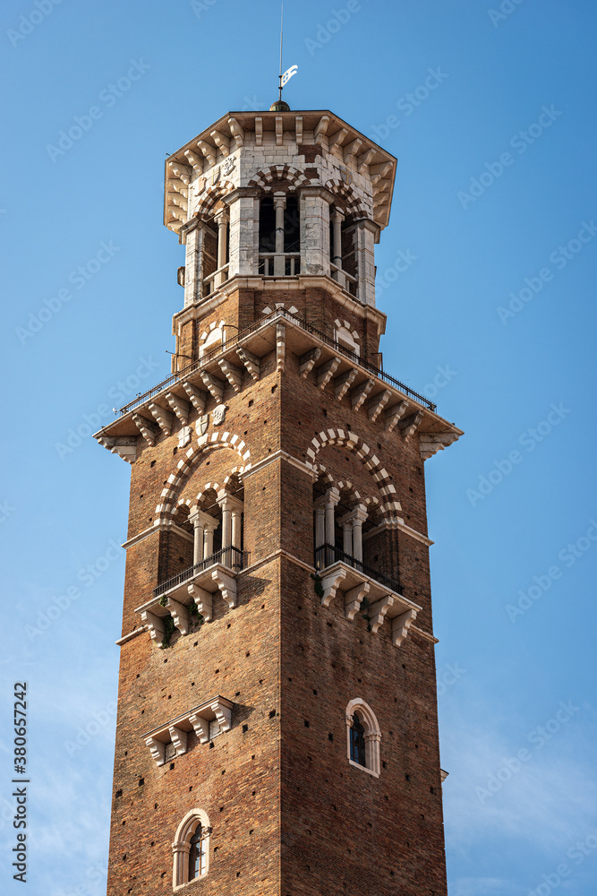 Verona. Closeup of the Torre dei Lamberti, medieval tower (XI century-1403), Piazza delle Erbe, UNESCO heritage site, Veneto, Italy, Europe.