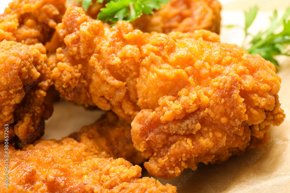 Tasty deep fried chicken pieces served on table, closeup Tasty deep fried chicken pieces served on table, closeup