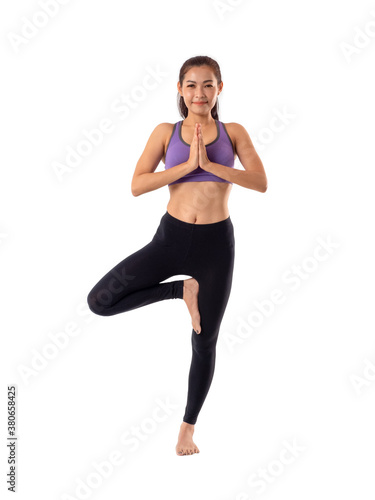 Healthy Asian woman wearing sports clothing, doing yoga pose on white background.