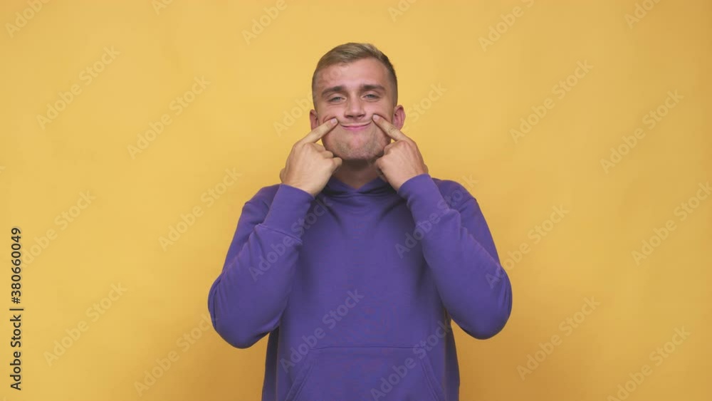 Young caucasian man doubting between two options Young caucasian man doubting between two options