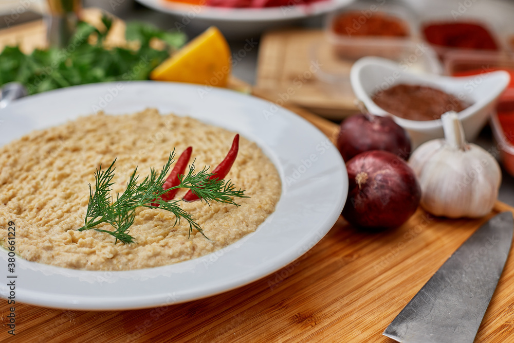 Many different spices, vegetables and ingredients, and fresh herbs for making homemade sauce Many different spices, vegetables and ingredients, and fresh herbs for making homemade sauce