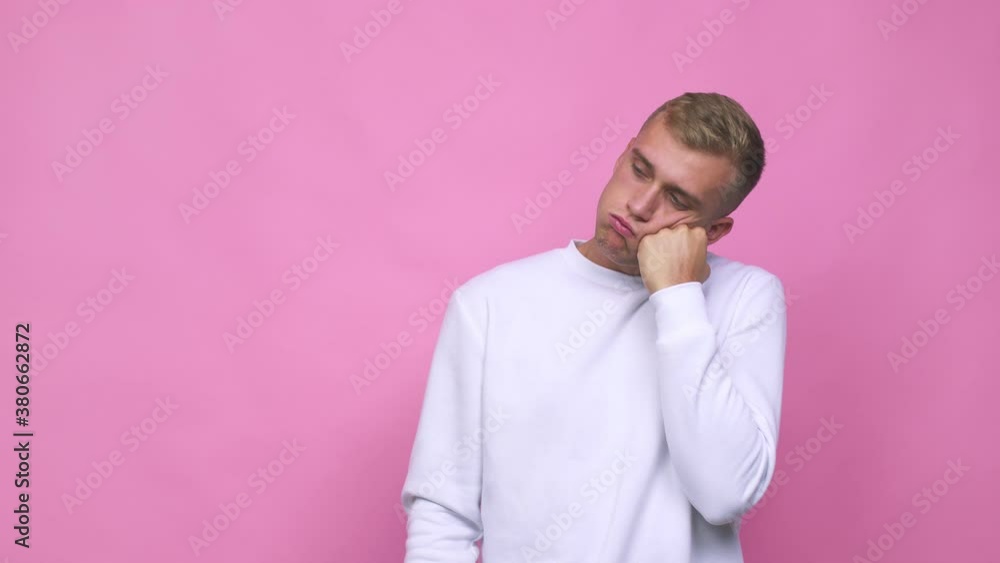 Young caucasian man who feels sad and pensive, looking at copy space Young caucasian man who feels sad and pensive, looking at copy space