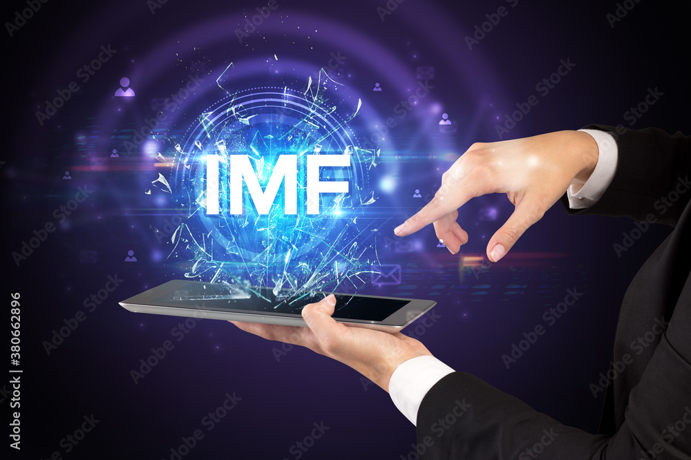 Close-up of a touchscreen with IMF abbreviation, modern technology concept Close-up of a touchscreen with IMF abbreviation, modern technology concept